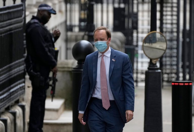 UK health secretary apologizes after pictures emerge of him embracing aide