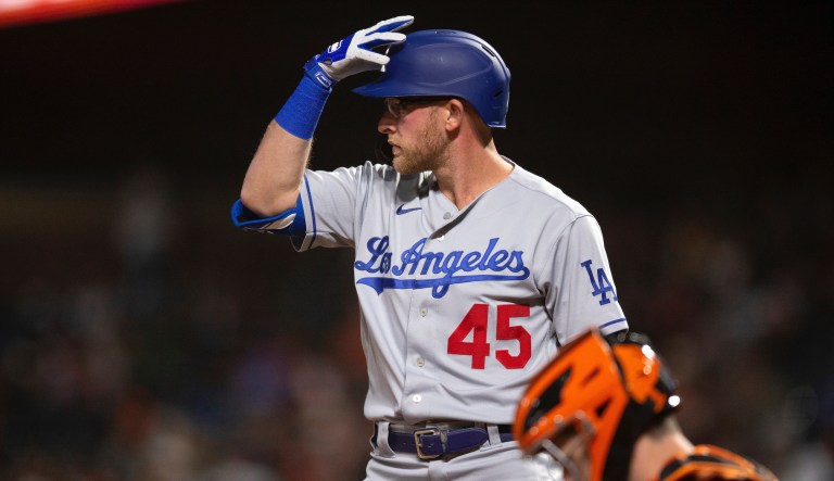 Los Angeles Dodgers pinch hitter Matt Beaty (45) adjusts his helmet during the ninth inning of a baseball game against the San Francisco Giants, Friday, May 21, 2021, in San Francisco.