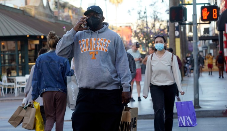 Shoppers wear masks amid the COVID-19 pandemic on The Promenade Wednesday, June 9, 2021, in Santa Monica, Calif.