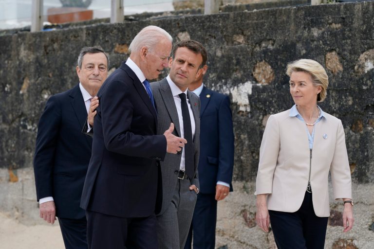 President Joe Biden speaks with French President Emmanuel Macron, center, European Commission President Ursula von der Leyen, right, and Italian Prime Minister Mario Draghi, left, after posing for the G-7 family photo with guests at the G-7 summit, Friday, June 11, 2021, in Carbis Bay, England. (AP Photo/Patrick Semansky, Pool)