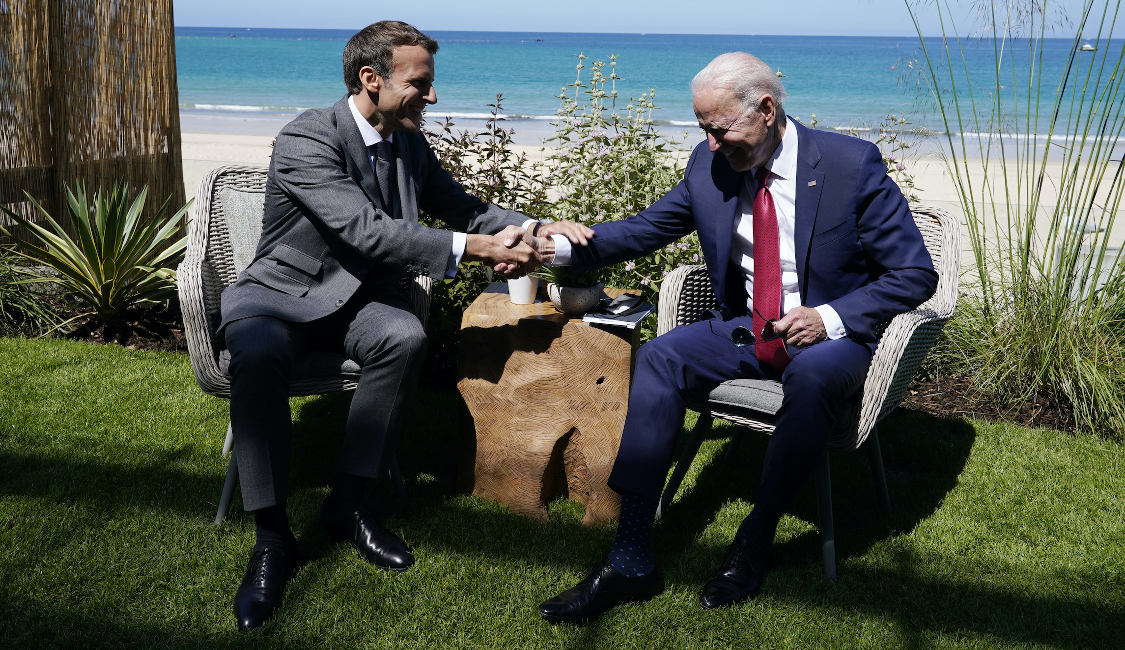Macron gets tres handsy with Biden and takes a shot at Trump during G-7