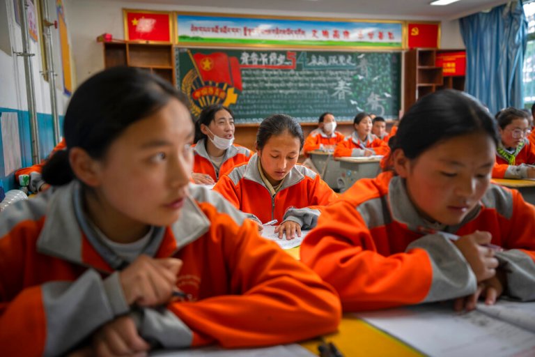 Students recite vocabulary during a Mandarin Chinese class at Nagqu No. 2 Senior High School, a public boarding school for students from northern Tibet, in Lhasa in western China's Tibet Autonomous Region, as seen during a rare government-led tour of the region for foreign journalists on June 1, 2021. Long defined by its Buddhist culture, Tibet is facing a push for assimilation and political orthodoxy under China's ruling Communist Party. 