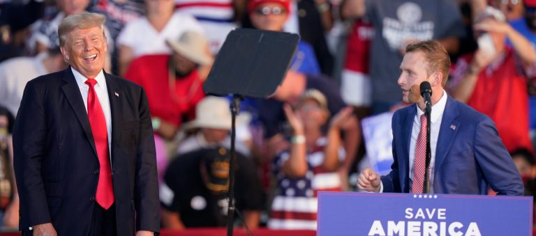 Former President Donald Trump laughs as Republican congressional candidate Max Miller speaks at a rally at the Lorain County Fairgrounds on June 26, 2021, in Wellington, Ohio. 