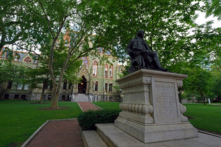 A statue of founder Benjamin Franklin sits in front of College Hall at the University of Pennsylvania on Saturday, July 3, 2021 in Philadelphia, Pennsylvania. 
