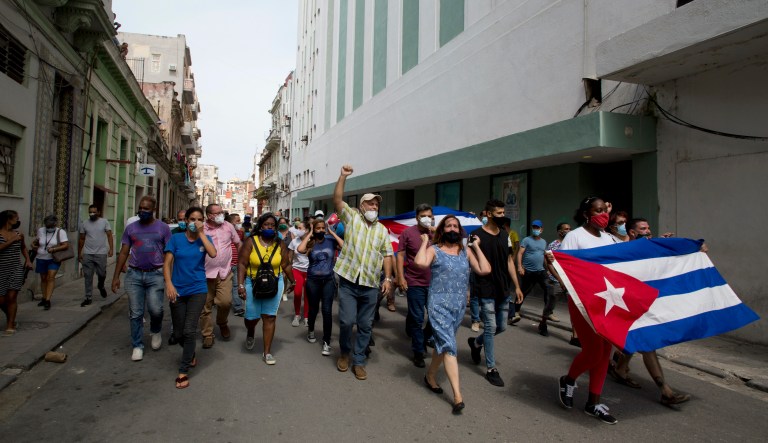 Backers of the government march in Havana, Cuba, Sunday, July 11, 2021. Hundreds of supporters of the government took to the streets while hundreds  protested against ongoing food shortages and high prices of foodstuffs.