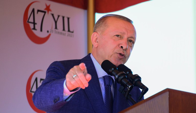 Turkish President Recep Tayyip Erdogan, talks before the military parade marking the 47th anniversary of the 1974 Turkish invasion in the Turkish occupied area of the divided capital Nicosia, Cyprus, Tuesday, July 20, 2021.