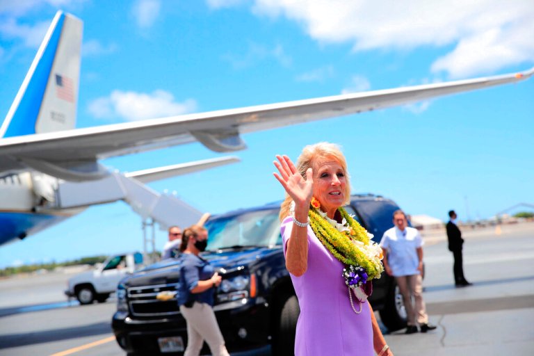 First lady Jill Biden waves to the media on the tarmac after arriving at Joint Base Pearl Harbor-Hickam, Hawaii, Saturday, July 24, 2021.