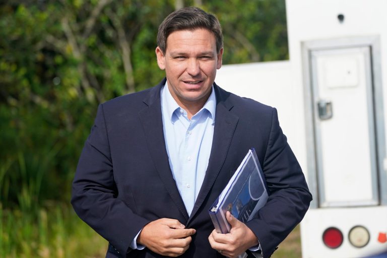 Florida school district drops mask mandate after DeSantis threatens to withhold funding