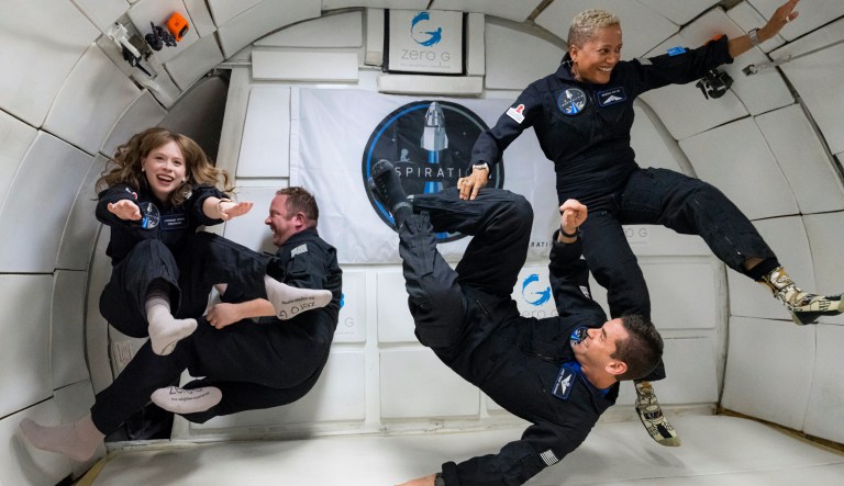 In this July 11, 2021 photo provided by John Kraus, from left, Hayley Arceneaux, Chris Sembroski, Jared Isaacman and Sian Proctor float during a zero gravity flight out of Las Vegas. The plane, a modified Boeing 727, flies multiple parabolic arcs to provide 20-30 seconds of weightlessness.