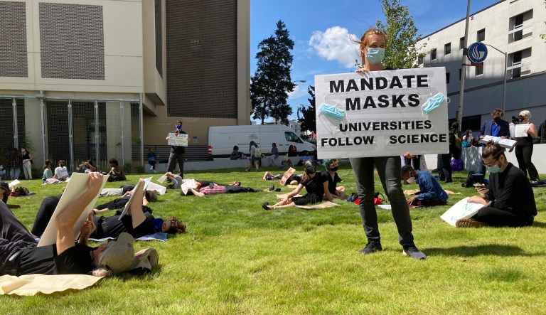 Protesters call for Georgia university administrators to mandate masks and vaccination on Thursday, Sept. 10, 2021 at a âdie-inâ at Georgia State University in Atlanta. Acting Chancellor Teresa MacCartney says the university system will not change its policy that restrains individual universities from requiring face coverings. 