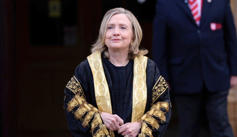 Former US Secretary of State Hillary Clinton poses for a photo after being inaugarated as the first female chancellor of Queens University, in Belfast, Northern Ireland, Friday, Sept. 24, 2021.