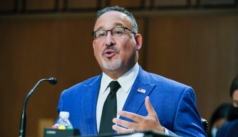In this Sept. 30, 2021, file photo, Education Secretary Miguel Cardona testifies on Capitol Hill in Washington.