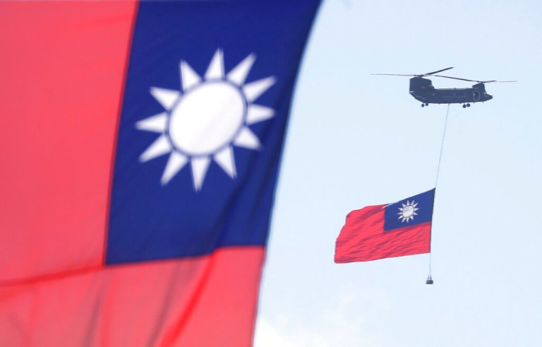 Helicopters take to the sky during National Day celebrations in front of the Presidential Building in Taipei, Taiwan, in 2021.