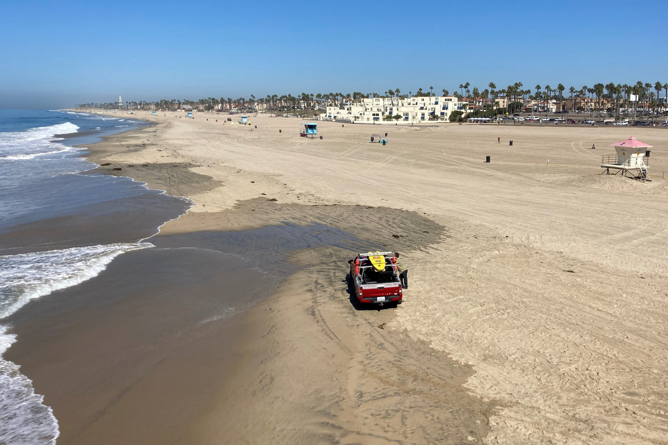 Surf City USA in California reopens beach after oil spill