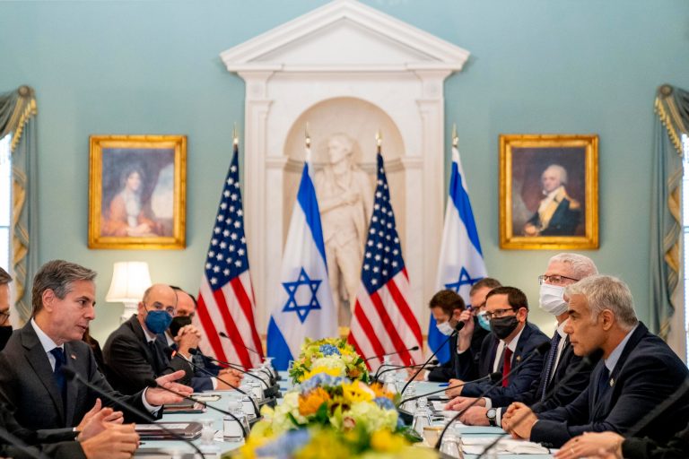 Secretary of State Antony Blinken, left, accompanied by Israeli Foreign Minister Yair Lapid, right, speaks at bilateral meeting at the State Department in Washington, Wednesday, Oct. 13, 2021. 
