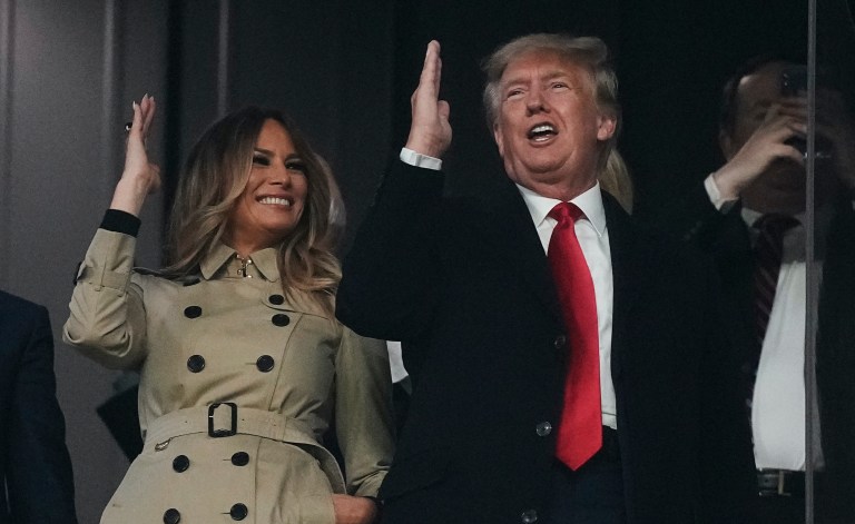 Former President Donald Trump and his wife Melania perform the tomahawk chop before for Game 4 of baseball's World Series between the Houston Astros and the Atlanta Braves Saturday, Oct. 30, 2021, in Atlanta.