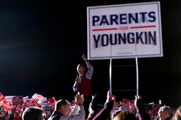 Democratic gubernatorial candidate former Virginia Gov. Terry McAuliffe reacts to the crowd during a rally in Richmond, Va., Sunday, Oct. 31, 2021.  McAuliffe will face Republican Glenn Youngkin in the November election.        