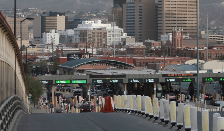 Migrants in Mexico rush international bridge in El Paso in tense border showdown