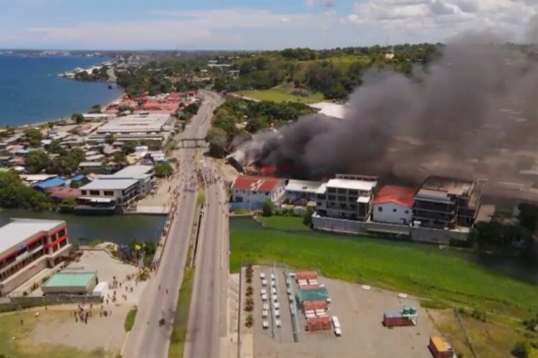 Australia sends forces to Solomon Islands where protesters set fire to Parliament and Chinatown