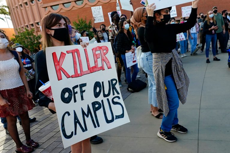 Students for Socialism protest on campus demanding that Kyle Rittenhouse not be allowed to enroll at Arizona State University, Wednesday, Dec. 1, 2021, at ASU in Tempe, Ariz. Protesters were demanding the university disavow the 18-year-old, who was acquitted of murder last month in the deadly shootings during last year's unrest in Kenosha.