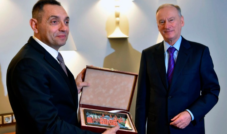 In this photo provided by the Serbian Interior Ministry, Serbian Interior Minister Aleksandar Vulin, left, poses with Nikolai Patrushev, secretary of the Kremlin's Security Council, in Moscow, Russia, on Friday, Dec. 3, 2021.