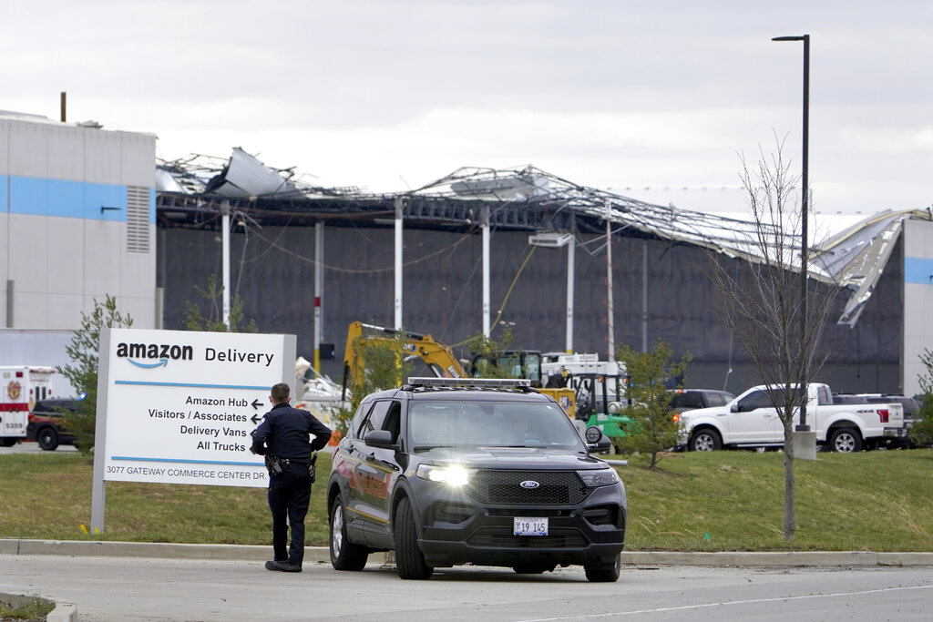 An Amazon fulfillment center is seen Saturday with collapsed walls and a large section of roof missing in Edwardsville, Illinois.