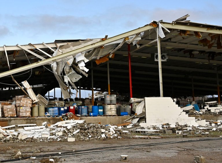 A feed store damaged by a tornado is seen in Mayfield, Kentucky, on Saturday.