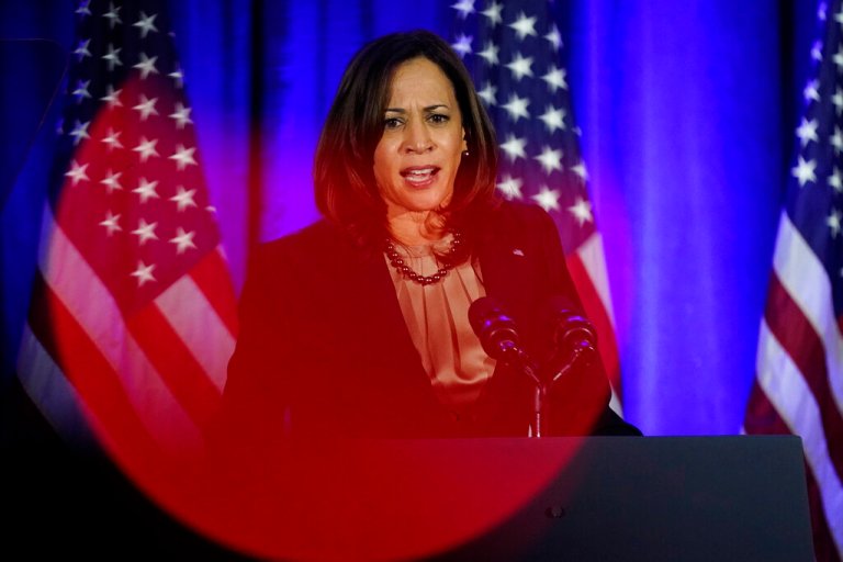 Vice President Kamala Harris speaks before President Joe Biden at a Democratic National Committee holiday party, Tuesday, Dec. 14, 2021, in Washington.