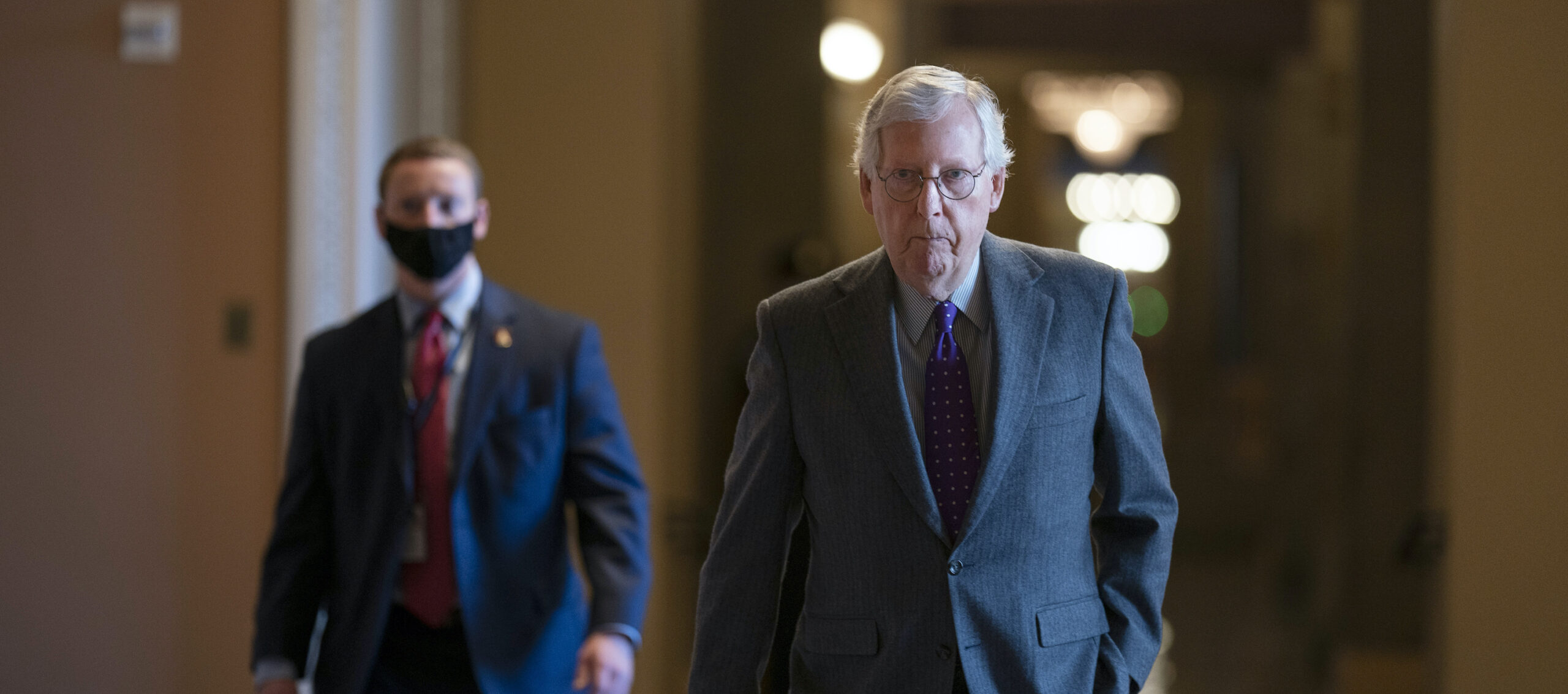 McConnell intensifies courting of Manchin to join GOP