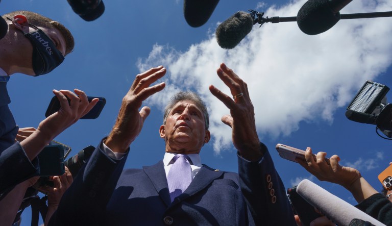 Sen. Joe Manchin, D-W.Va., a centrist Democrat vital to the fate of President Joe Biden's $3.5 government overhaul, updates reporters about his position on the bill, at the Capitol in Washington, Thursday, Sept. 30, 2021.