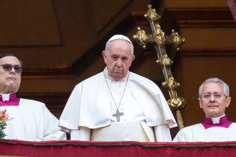 Pope Francis looks at the crowd after delivering the Urbi et Orbi (Latin for 'to the city and to the world' ) Christmas' day blessing from the main balcony of St. Peter's Basilica at the Vatican, Saturday, Dec. 25, 2021.