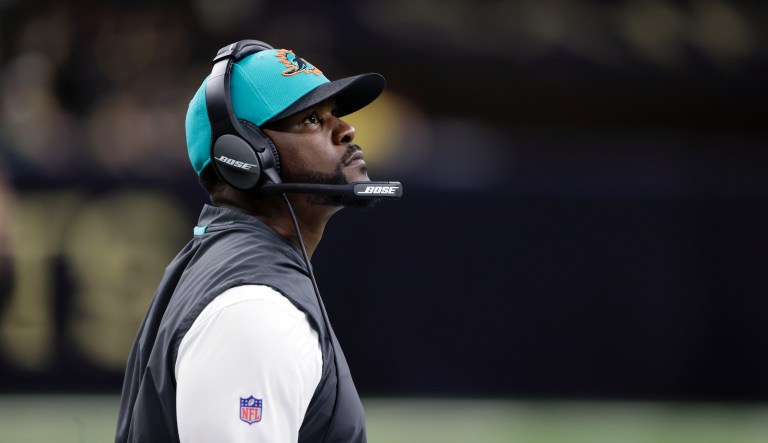 Miami Dolphins head coach Brian Flores looks up at the scoreboard during the second half of an NFL football game Monday, Dec. 27, 2021, in New Orleans. The Dolphins won 20-3.