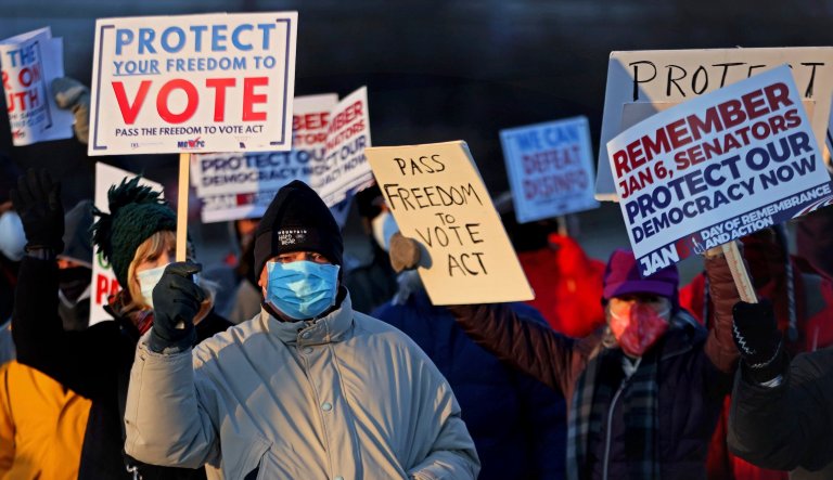 Ken Freedland, of Warson Woods, Missouri and several other advocates demonstrate for new voting laws on Thursday, Jan. 6, 2022, at Brentwood and Eager Roads in Brentwood, Missouri to commemorate the one-year anniversary of the Jan. 6th insurrection at the U.S. Capitol in Washington D.C. and push for voting rights protection.
Photo by Christian Gooden, cgooden@post-dispatch.com