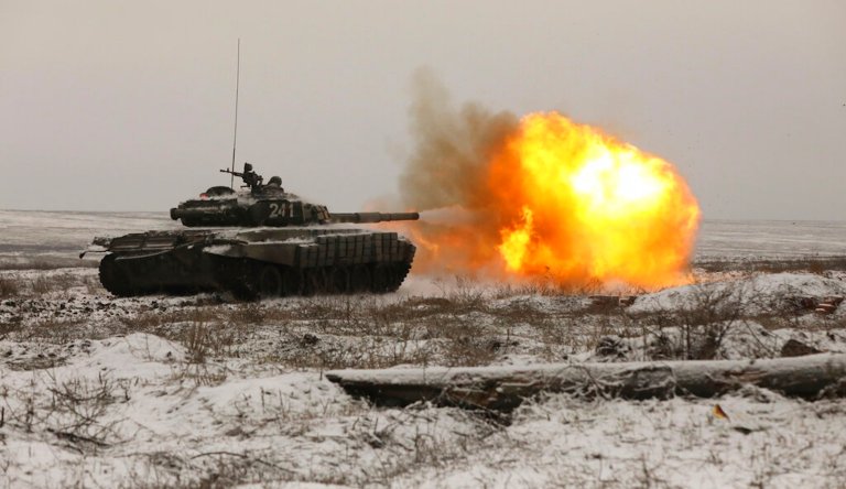 A Russian tank T-72B3 fires as troops take part in drills at the Kadamovskiy firing range in the Rostov region in southern Russia, Wednesday, Jan. 12, 2022. Russia has rejected Western complaints about its troop buildup near Ukraine, saying it deploys them wherever it deems necessary on its own territory.