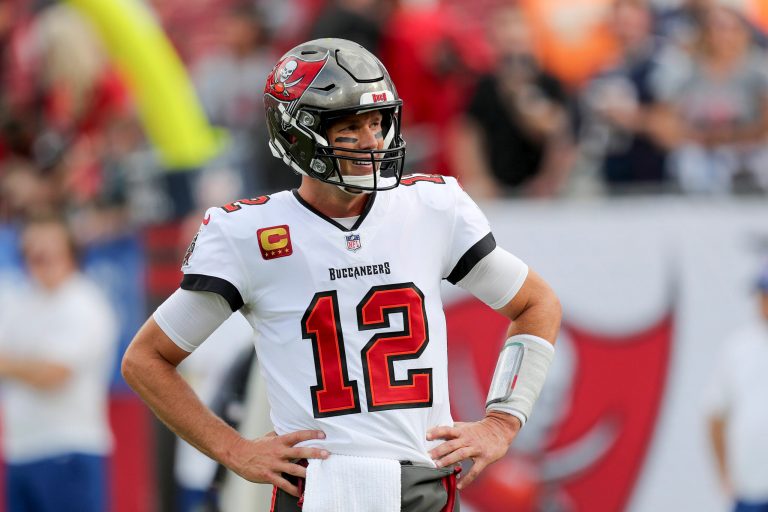 Tampa Bay Buccaneers quarterback Tom Brady (12) looks at the sideline for instructions during a NFL football game against the Carolina Panthers, Sunday, Jan. 9, 2022, in Tampa, Fla. The Buccaneers play the Philadelphia Eagles in an NFC wild-card game on Sunday. 