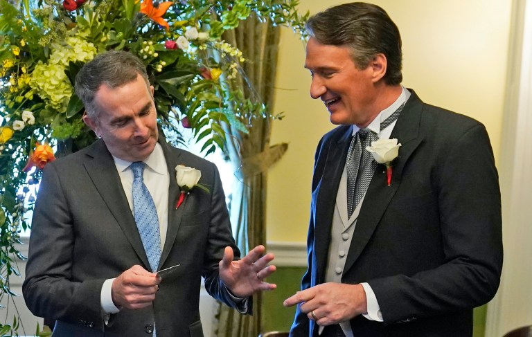 Northam pranks Youngkin with life-size Trump cutout and items from his past