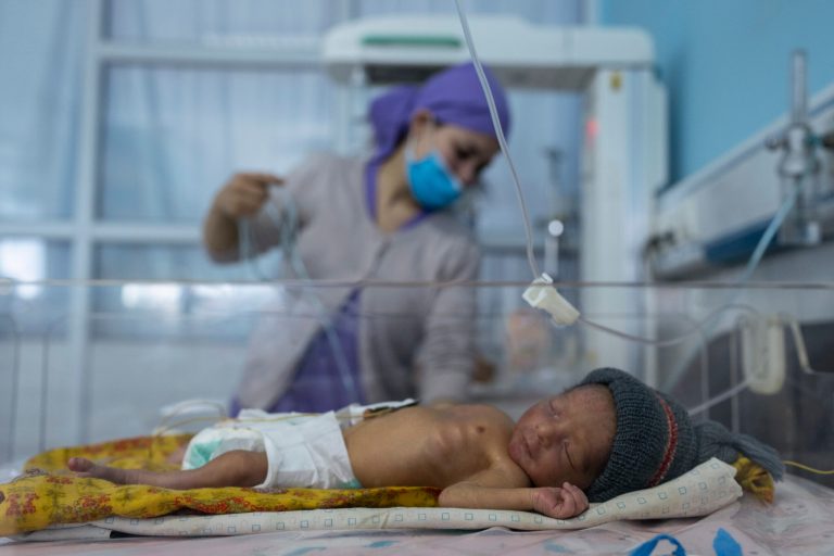 A nurse takes care of a baby in the neonatal intensive care unit of Malalai Maternity hospital in Kabul Afghanistan. 