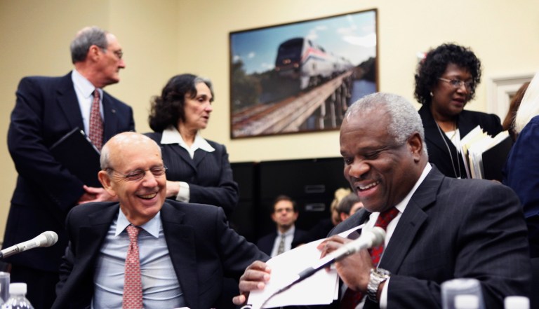 Supreme Court Associate Justices Stephen Breyer, left, and Clarence Thomas preside to testify on Capitol Hill.