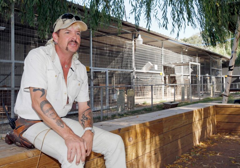 In this Aug. 28, 2013, photo, Joseph Maldonado answers a question during an interview at the zoo he runs in Wynnewood, Oklahoma. Maldonado, known also as âTiger Kingâ Joe Exotic, is headed to a federal courtroom Friday, Jan. 28, 2022, for a resentencing hearing. He's now in federal prison after a jury convicted him in a murder-for-hire plot involving his chief rival, Carole Baskin.