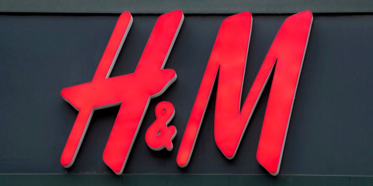 The logo of the clothing manufacturer 'H&M' is pictured on the entrance of a company's store at the Kurfuerstendamm shopping boulevard in Berlin, Germany, Tuesday, Feb. 1, 2022. 