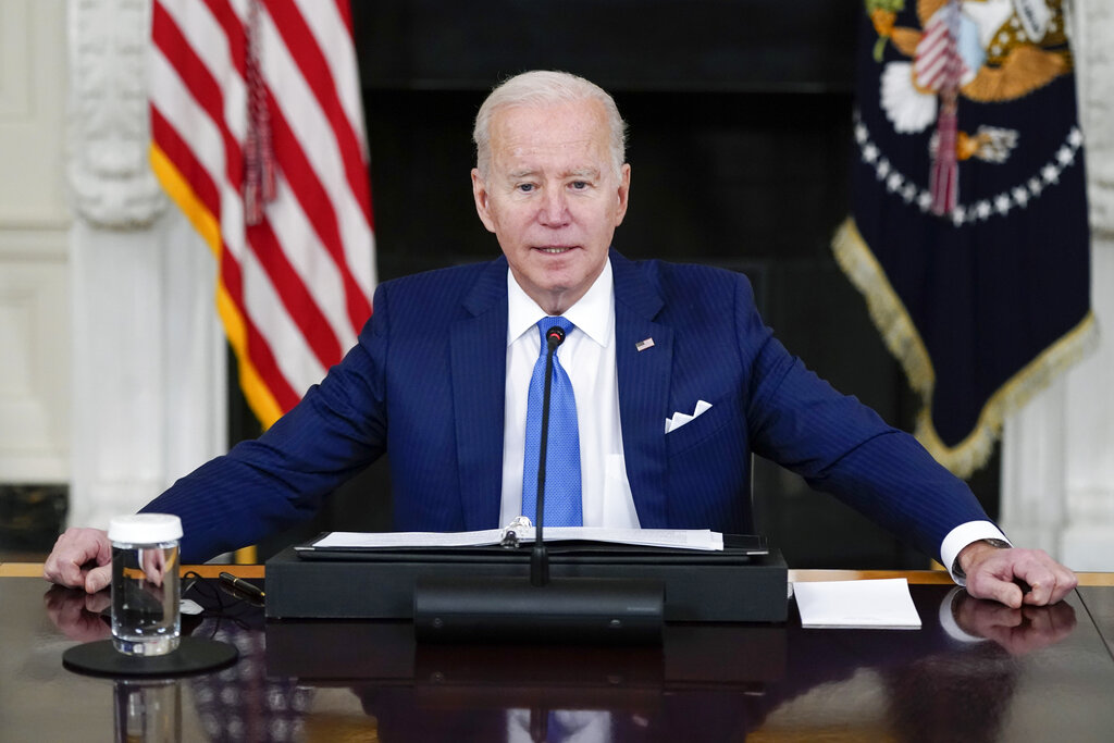On COVID, Biden leads from behind