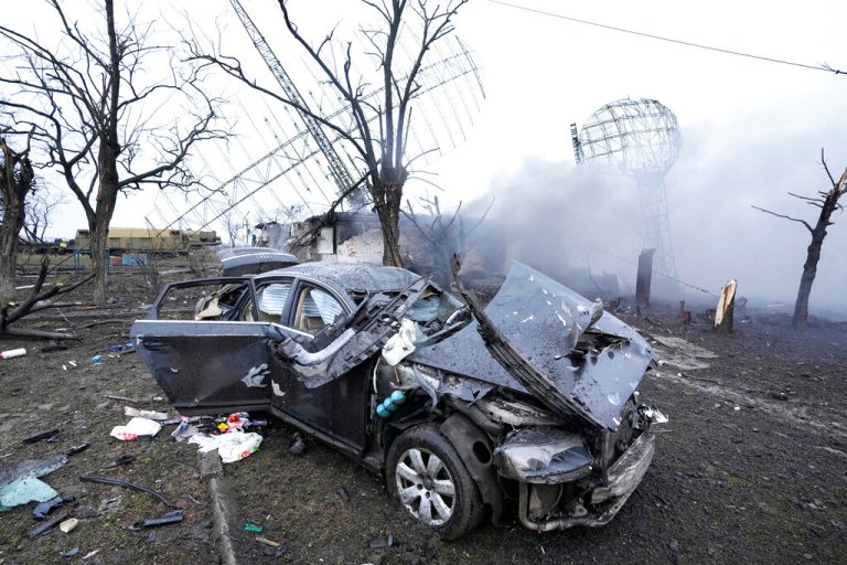 Damaged radar, a vehicle, and equipment are seen at a Ukrainian military facility outside Mariupol, Ukraine, Thursday.
