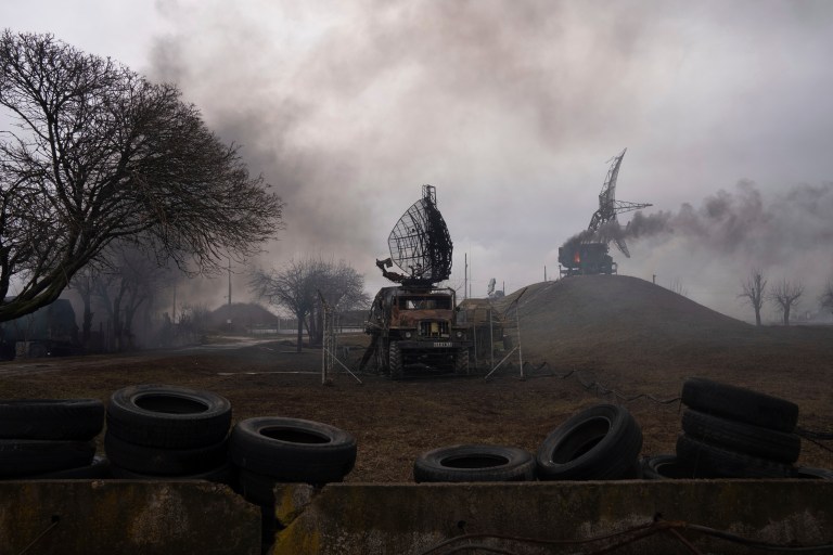 Smoke rises from an air defense base in the aftermath of an apparent Russian strike in Mariupol, Ukraine, Thursday.