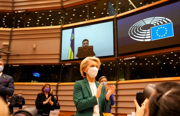 European Commission President Ursula von der Leyen applauds after an address by Ukraine's President Volodymyr Zelenskyy, via video link, during an extraordinary session on Ukraine at the European Parliament in Brussels, Tuesday, March 1, 2022. The European Union's legislature meets in an extraordinary session to assess the war in Ukraine and condemn the invasion of Russia. EU Commission President Ursula von der Leyen and Council President Charles Michel will be among the speakers.