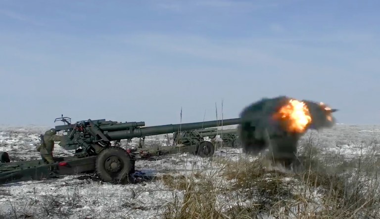 FILE - In this photo taken from video provided by the Russian Defense Ministry Press Service on Friday, Jan. 28, 2022, Russian troops fire howitzers during drills in the Rostov region during a military exercising at a training ground in Rostov region, Russia.