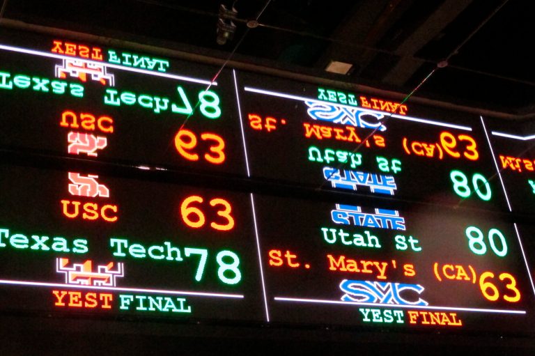 A scrolling video board with basketball scores is reflected in the ceiling of the DraftKings sportsbook in Atlantic City, New Jersey, on Nov. 20, 2018.