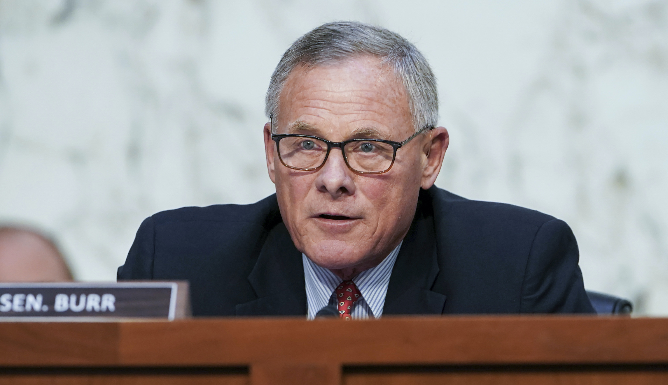 DOJ ordered to release more warrant details in Burr stock trading investigation