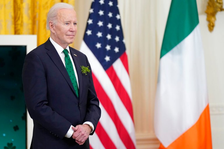 President Joe Biden waits to speak at a St. Patrick's Day celebration in the East Room of the White House, Thursday, March 17, 2022, in Washington.