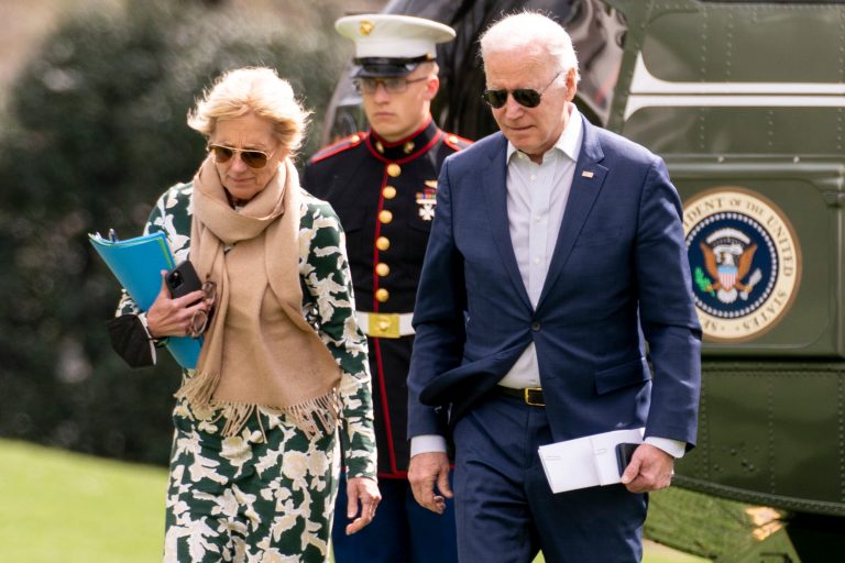 President Joe Biden and first lady Jill Biden arrive at the White House in Washington.