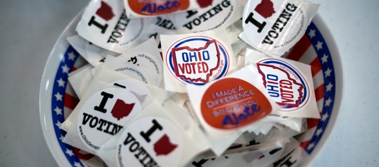 A bowl of stickers waits for voters after they cast their early ballot at the Jefferson County Board of Elections office in Steubenville, Ohio, on Monday, April 4, 2022. The state's primary was May 3. (AP Photo/Gene J. Puskar)